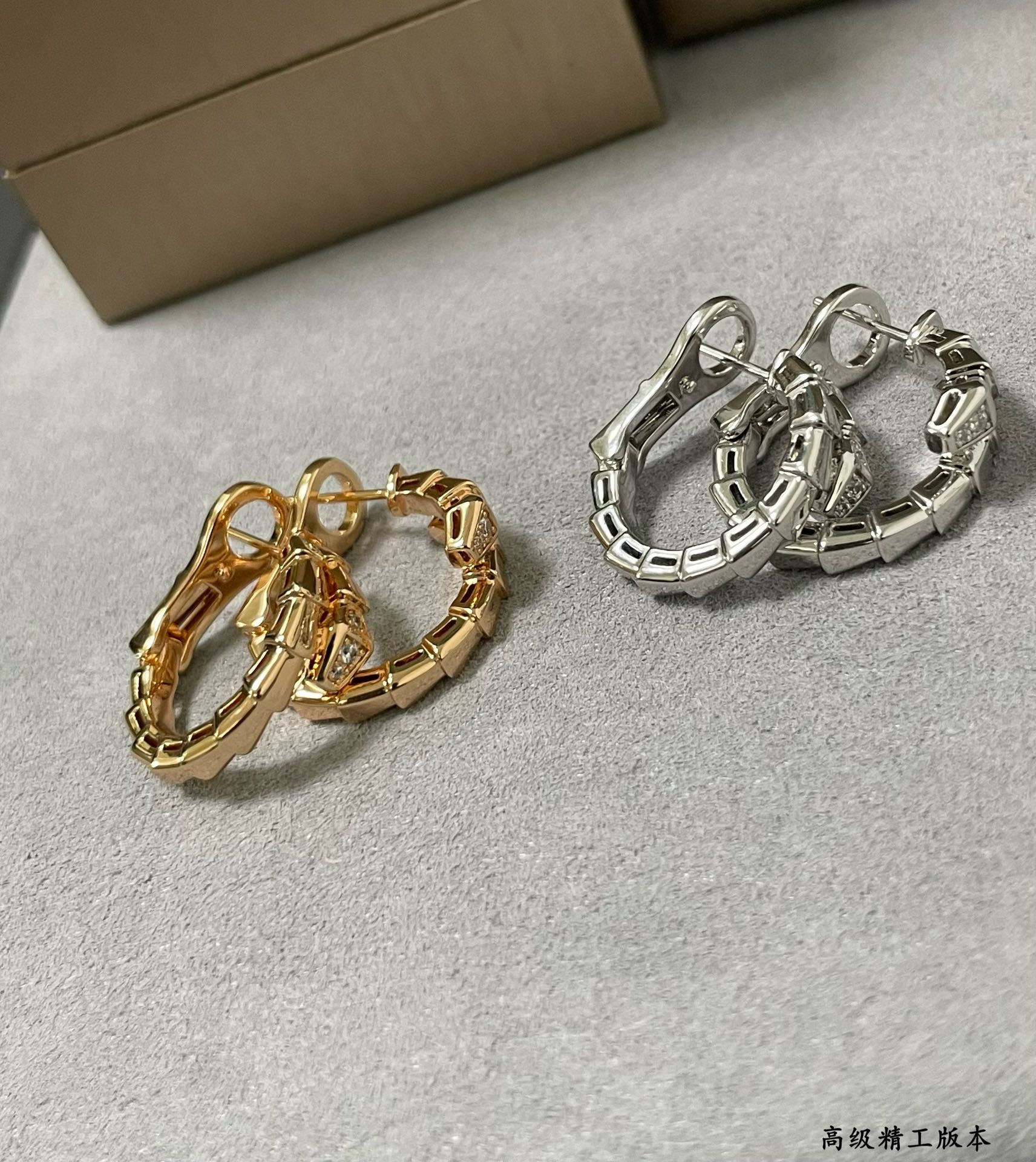 B*l*ai head and tail drill snake earrings