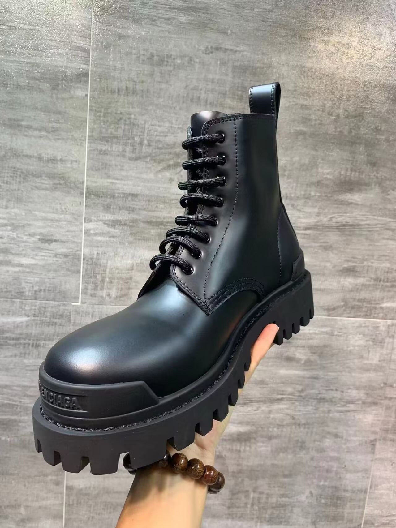 ua Ba*len*cia*ga strike lace-up boot in black