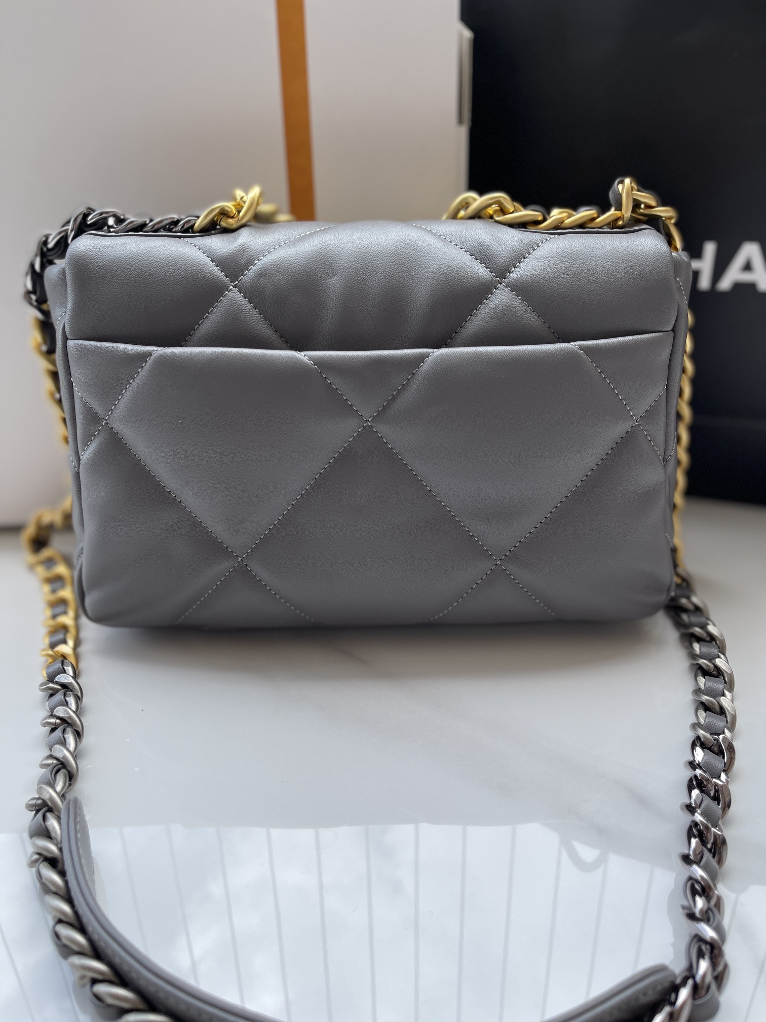 Ch*el 19 handbag shiny leather, gold-tone, silver-tone & ruthenium-finish metal dark gray 6.2 × 10.1 × 3.5 in