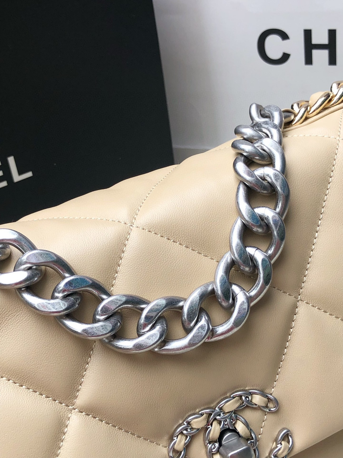 Ch*el 19 handbag shiny leather, gold-tone, silver-tone & ruthenium-finish metal beige 30x20x10cm