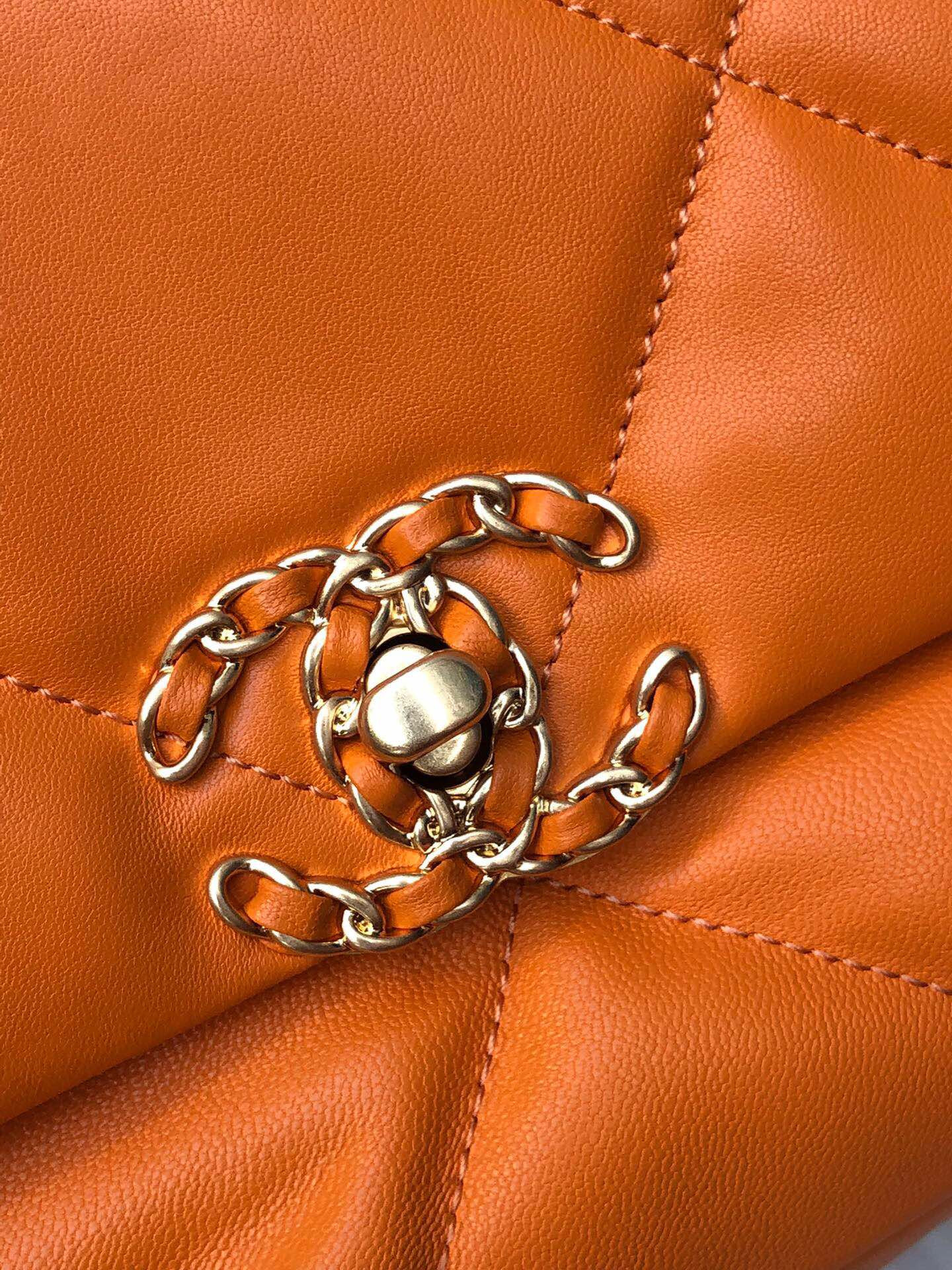 Ch*el 19 handbag shiny leather, gold-tone, silver-tone & ruthenium-finish metal orange 6.2 × 10.1 × 3.5 in