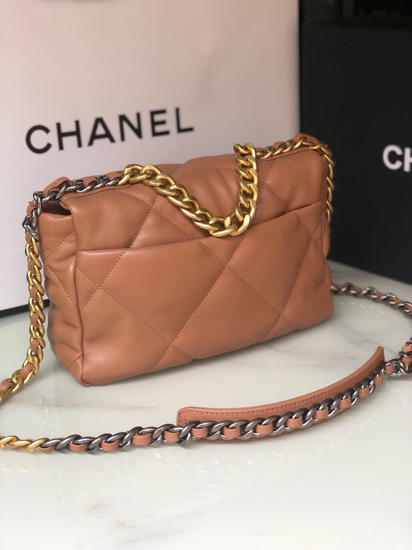 Ch*el 19 handbag shiny leather, gold-tone, silver-tone & ruthenium-finish metal caramel 6.2 × 10.1 × 3.5 in