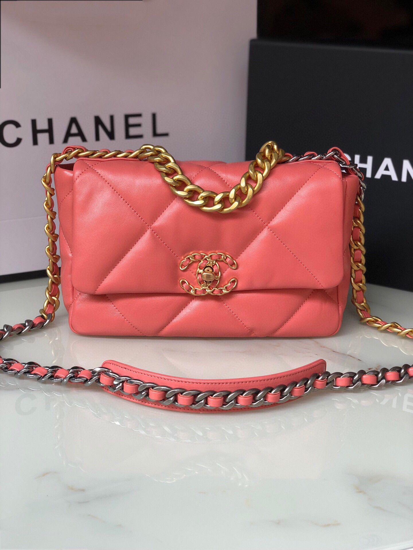 Ch*el 19 handbag shiny pink gold-tone, silver-tone & ruthenium-finish metal 6.2 × 10.1 × 3.5 in