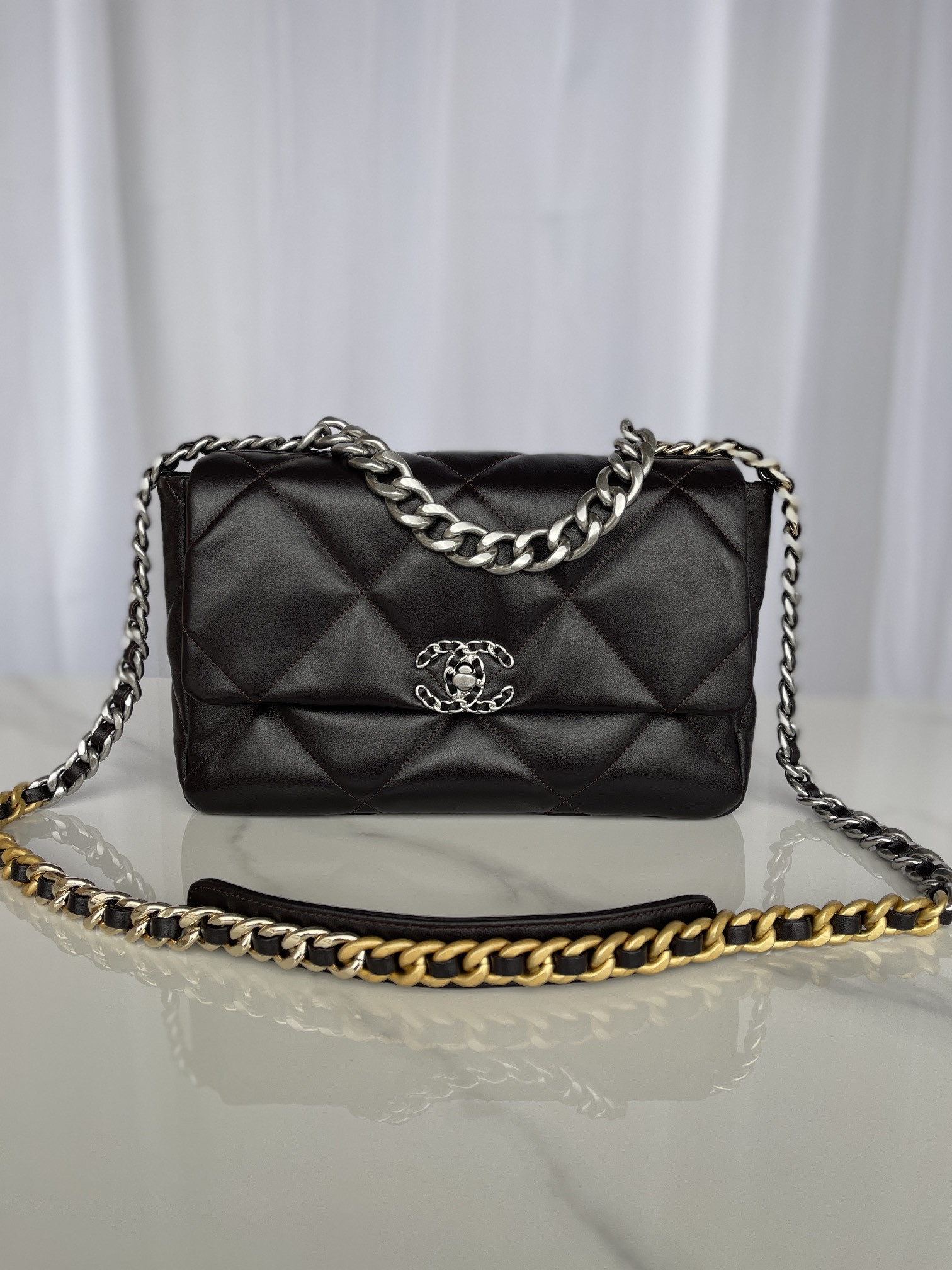 Ch*el 19 large handbag shiny leather black, gold-tone, silver-tone & ruthenium-finish metal 7.8 × 11.7 × 3.9 in