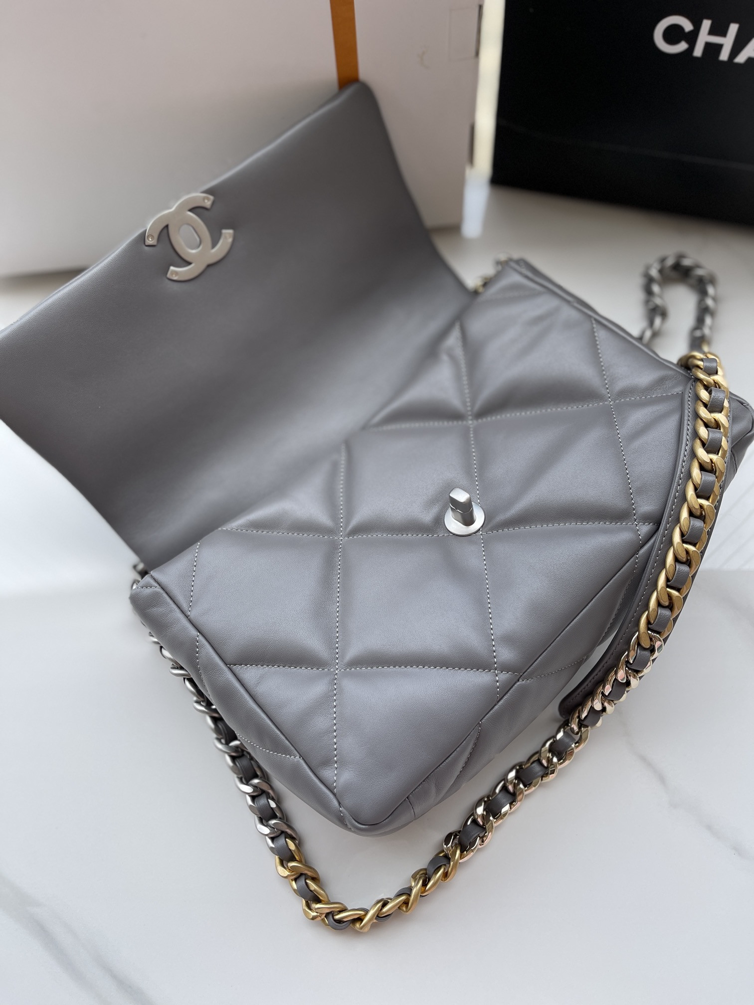 Ch*el 19 large handbag shiny leather, gold-tone, silver-tone & ruthenium-finish metal gray 7.8 × 11.7 × 3.9 in
