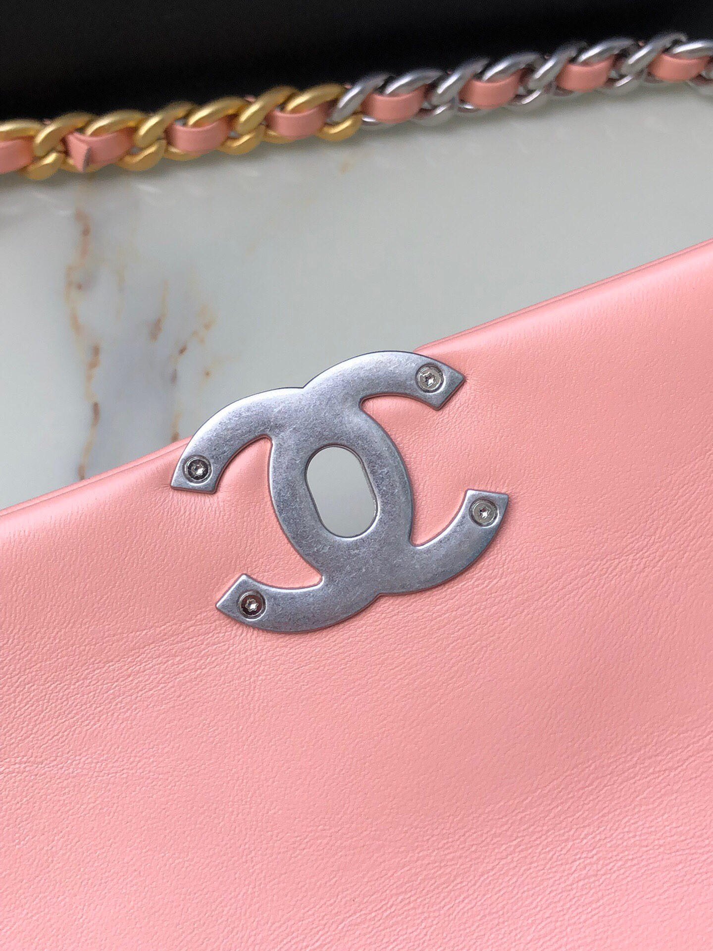 Ch*el 19 large handbag shiny leather, gold-tone, silver-tone & ruthenium-finish metal light pink 7.8 × 11.7 × 3.9 in