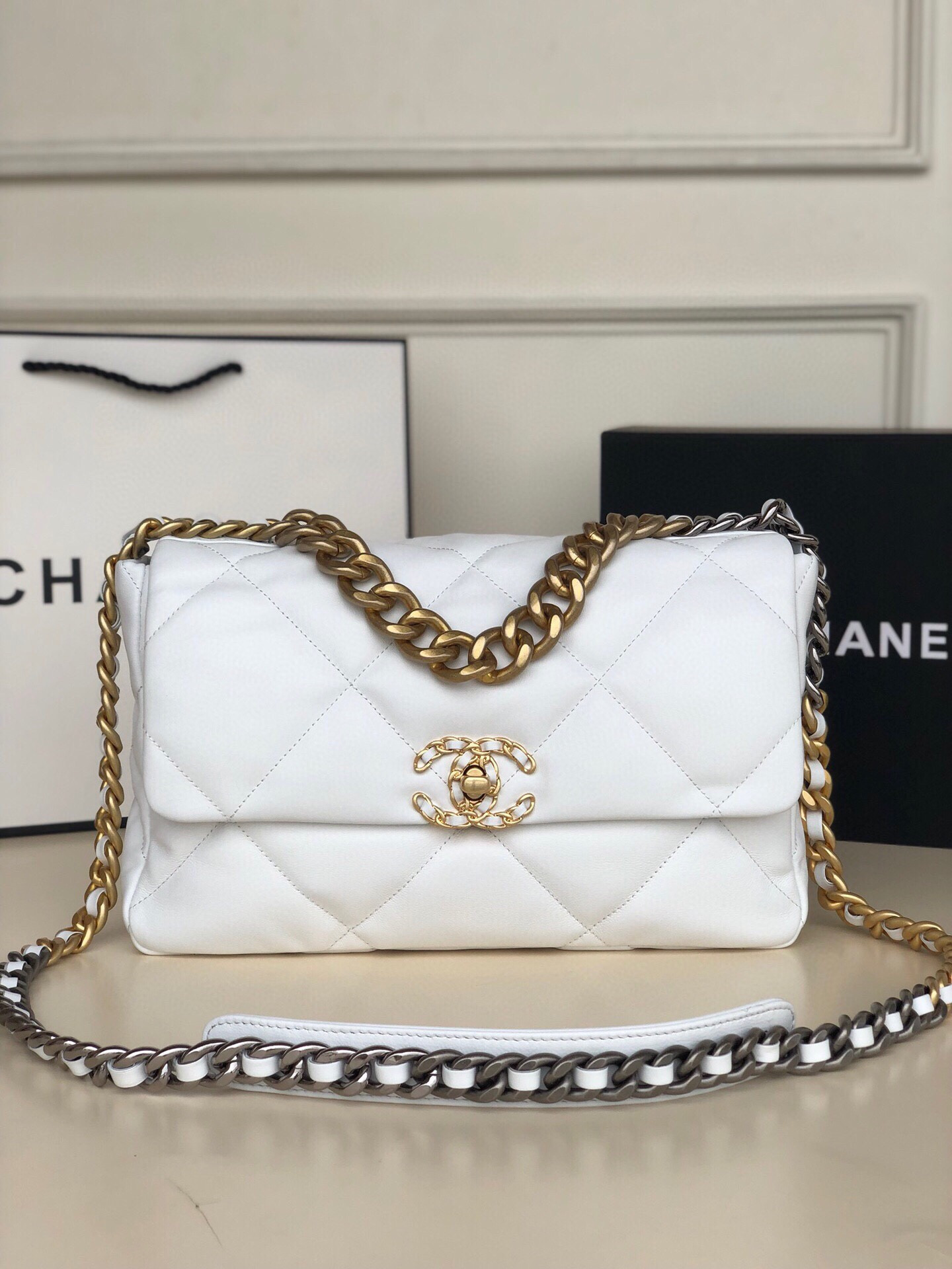 Ch*el 19 large handbag shiny leather, gold-tone, silver-tone & ruthenium-finish metal white 7.8 × 11.7 × 3.9 in