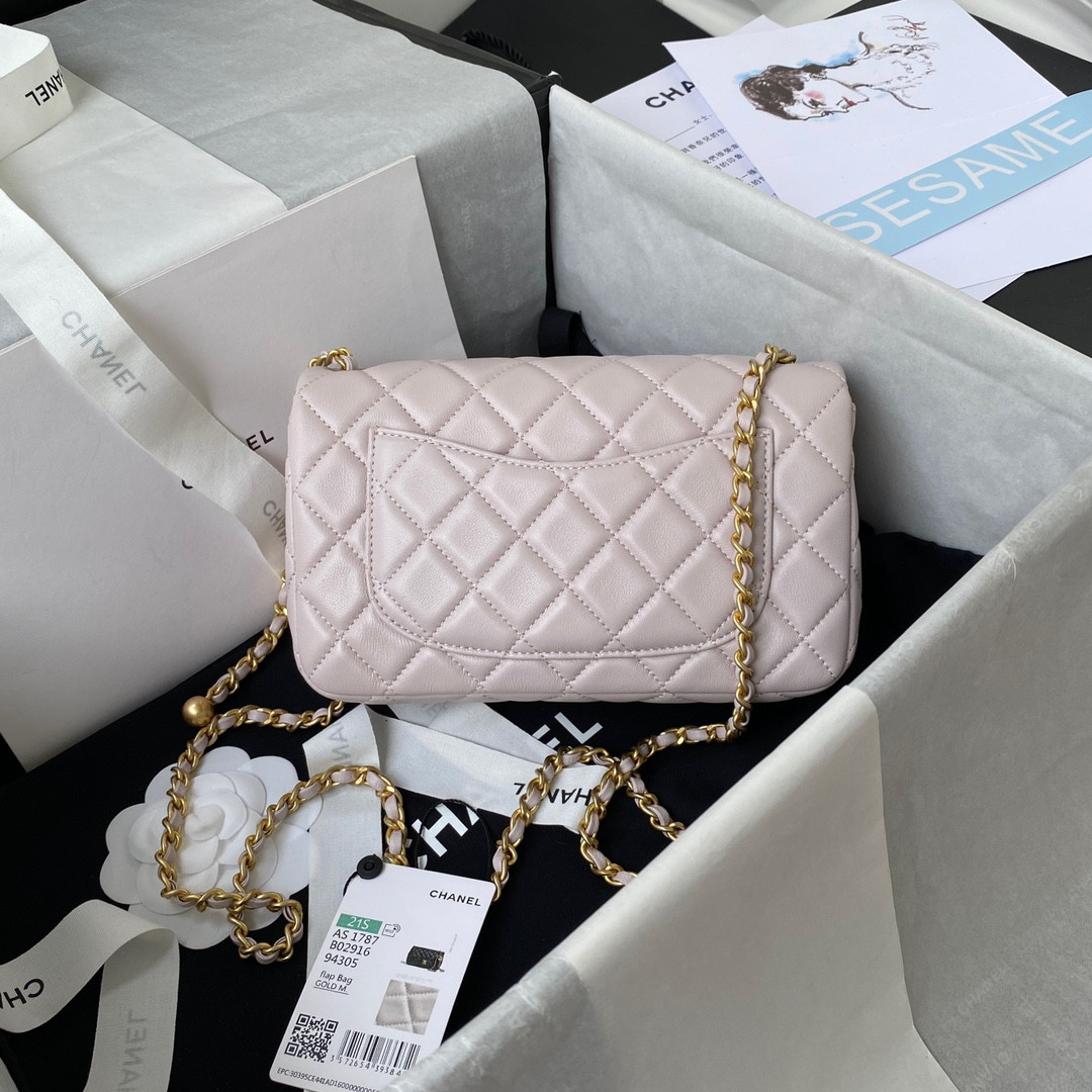 Ch*el mini flap bag shiny calfskin & gold-tone metal light pink 4.7 × 7.8 × 2.3 in