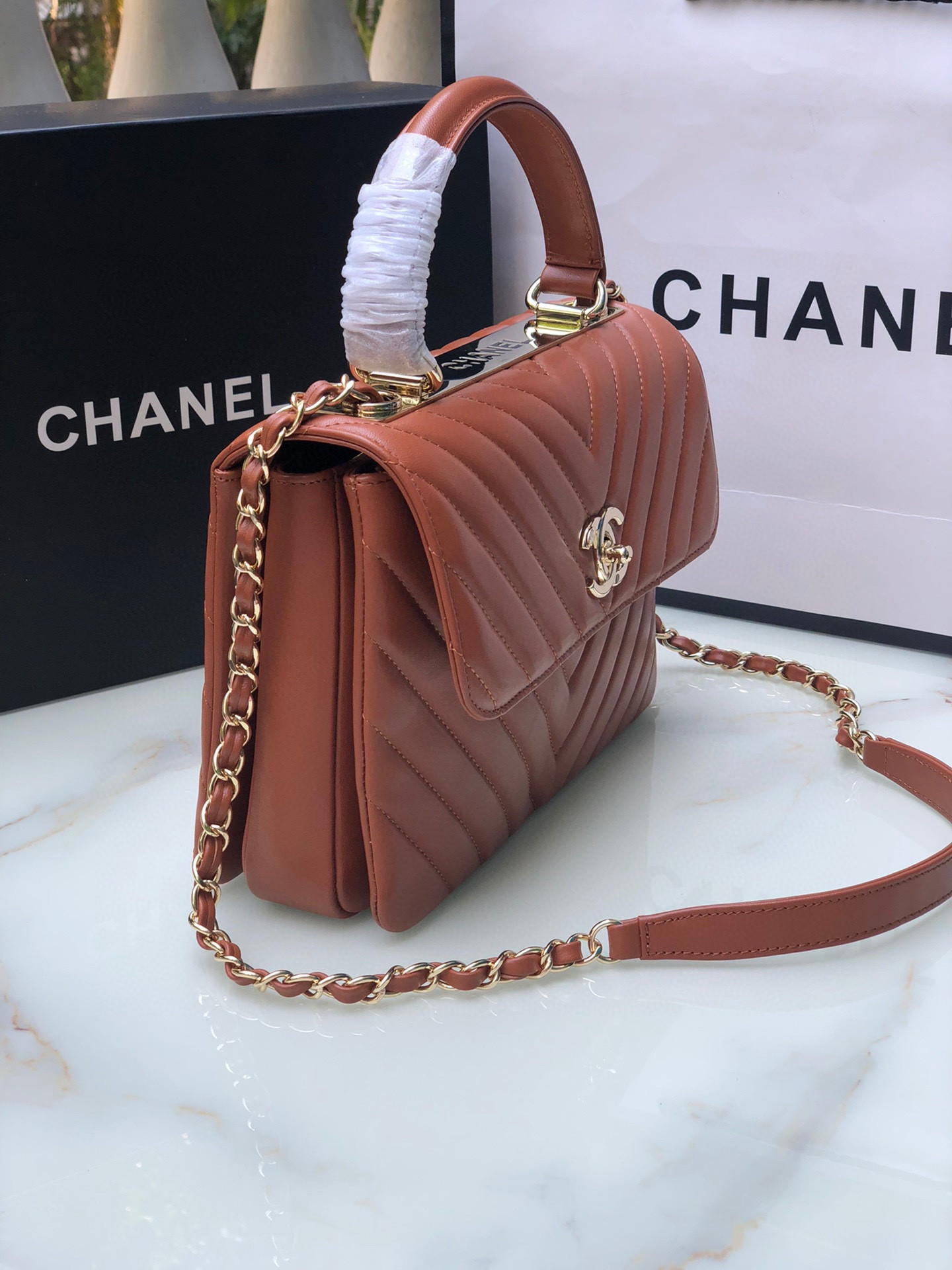 Ch*el flap bag with top handle orange 6.6 × 9.8 × 4.7 in
