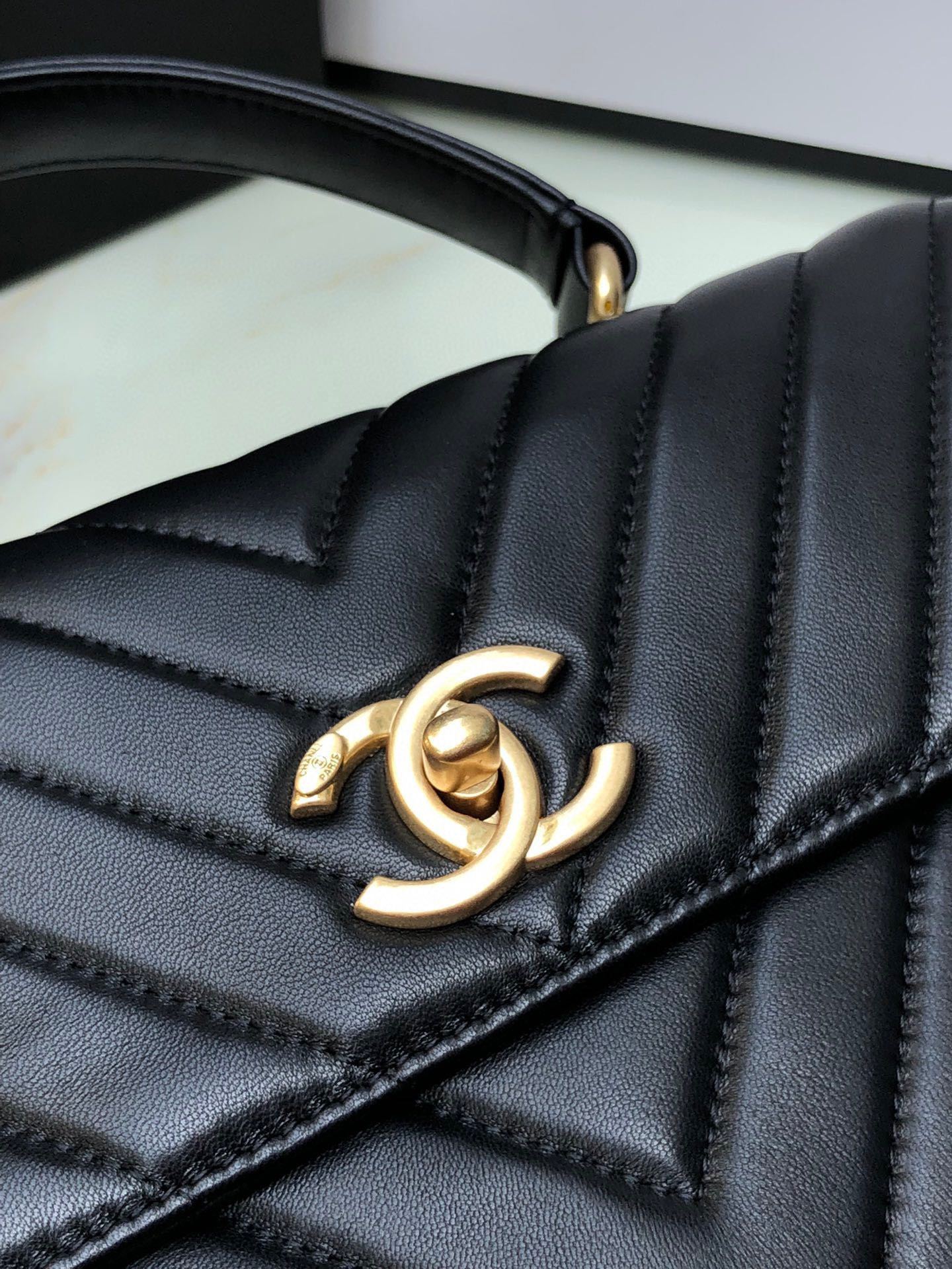 Ch*el flap bag with top handle 6.6 × 9.8 × 4.7 in