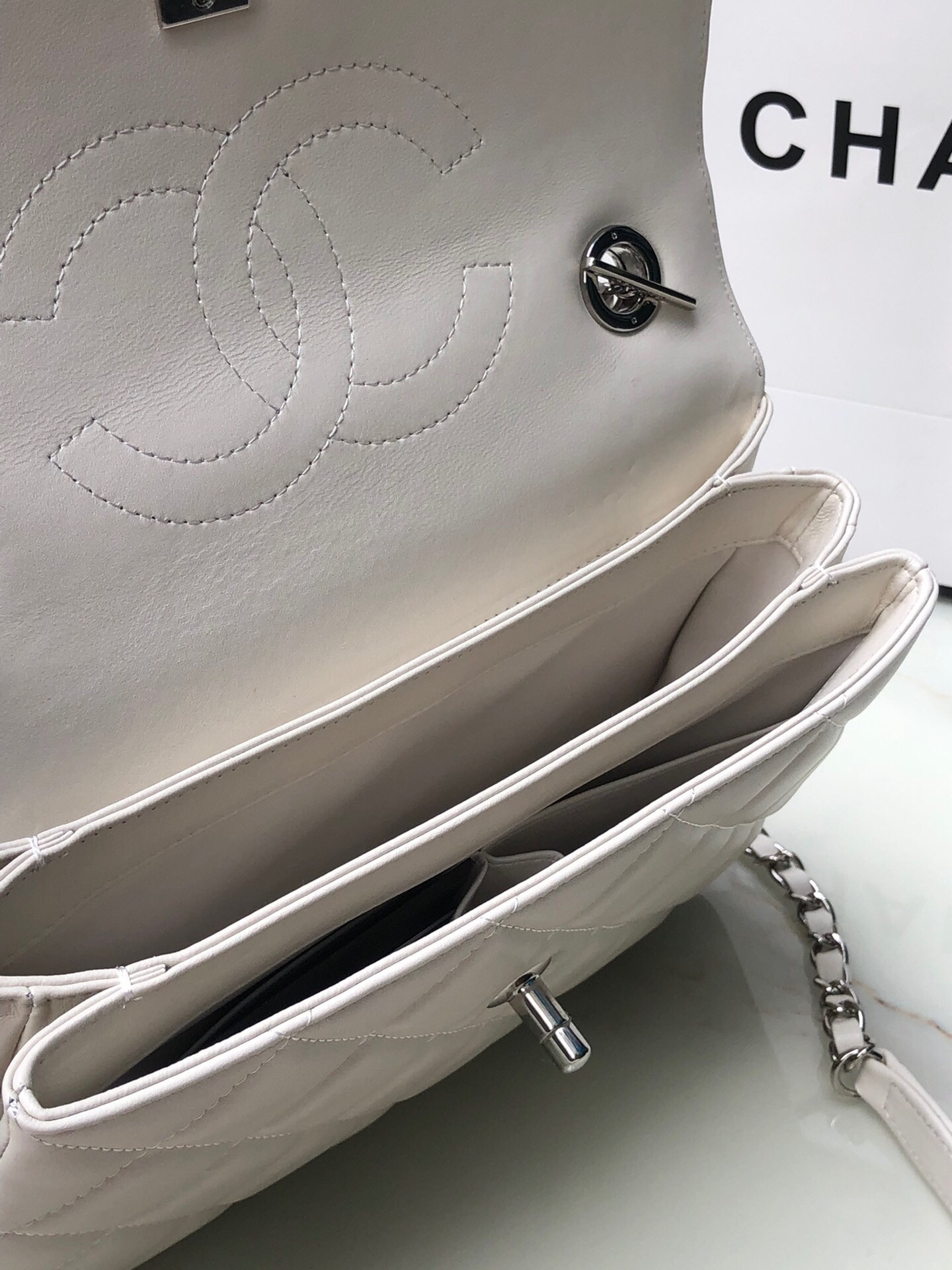 Ch*el flap bag with top handle 6.6 × 9.8 × 4.7 in