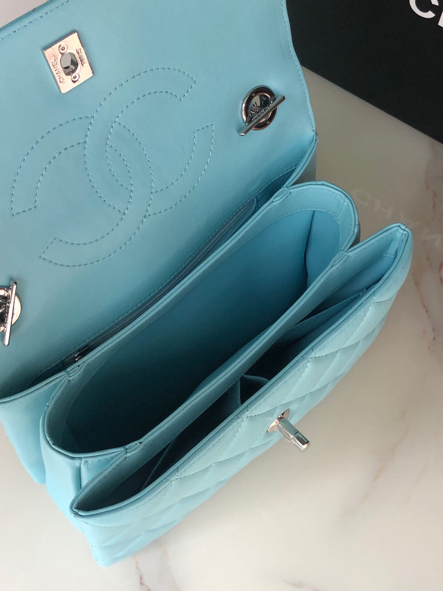 Ch*el flap bag with top handle 6.6 × 9.8 × 4.7 in