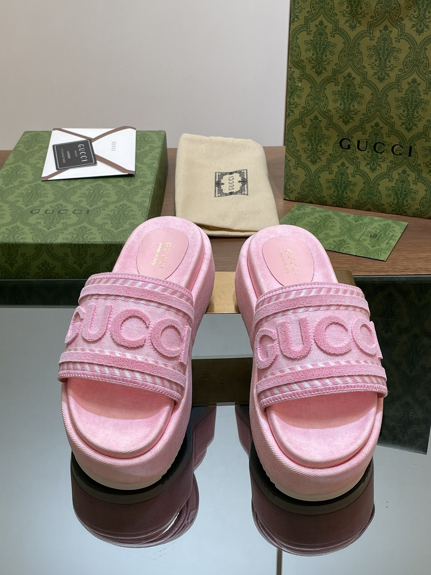 ua G*u*i slide sandal with G*u*i script