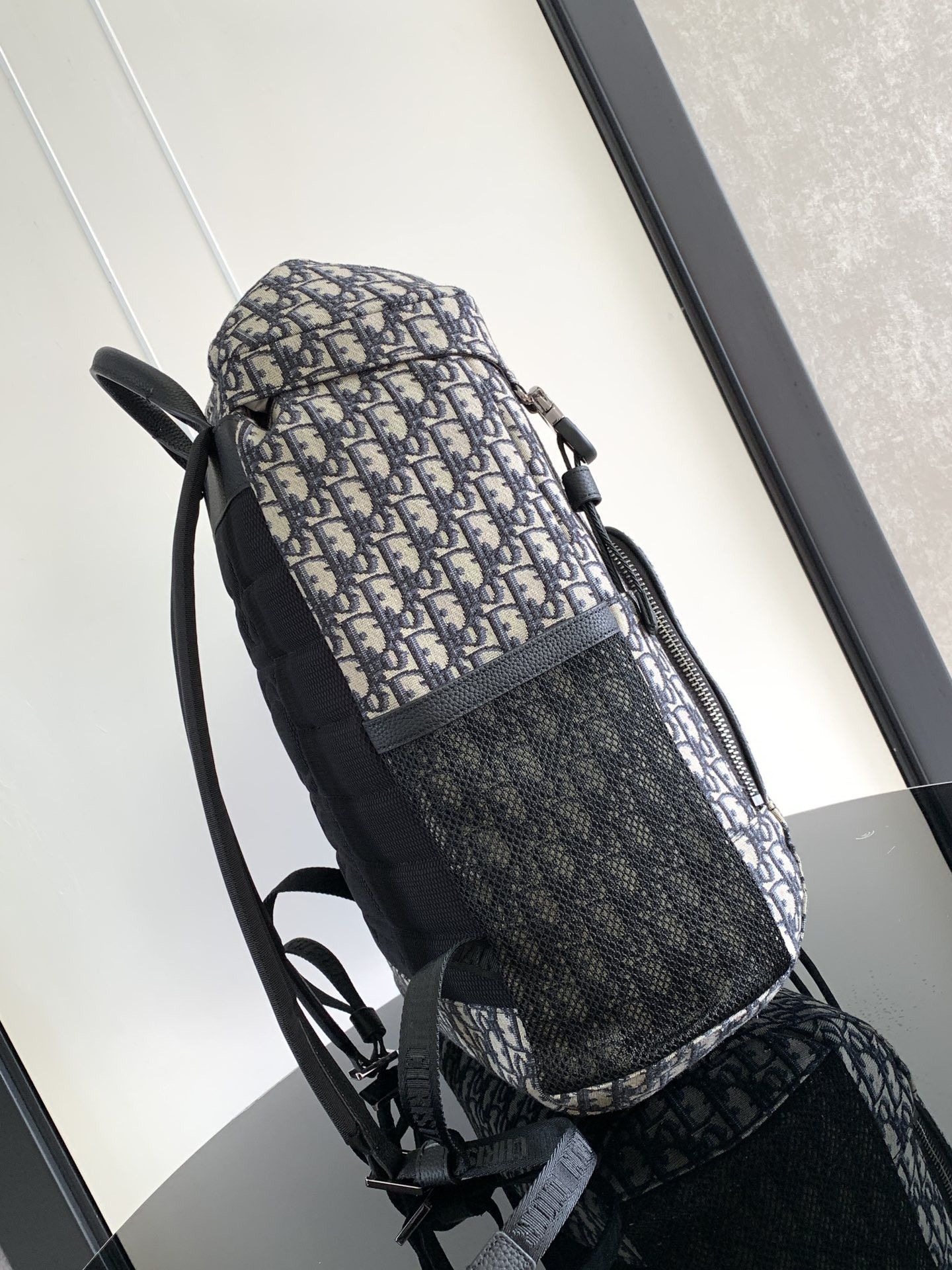 D*or 8 backpack with flap beige and black D*or oblique jacquard 31 x 48 x 16.5 cm