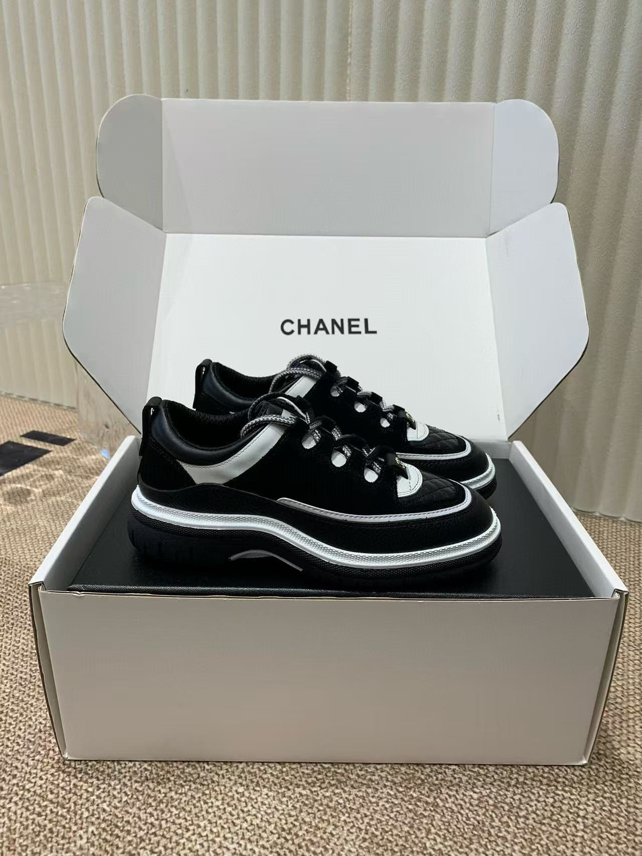 UA Ch**el Sneaker