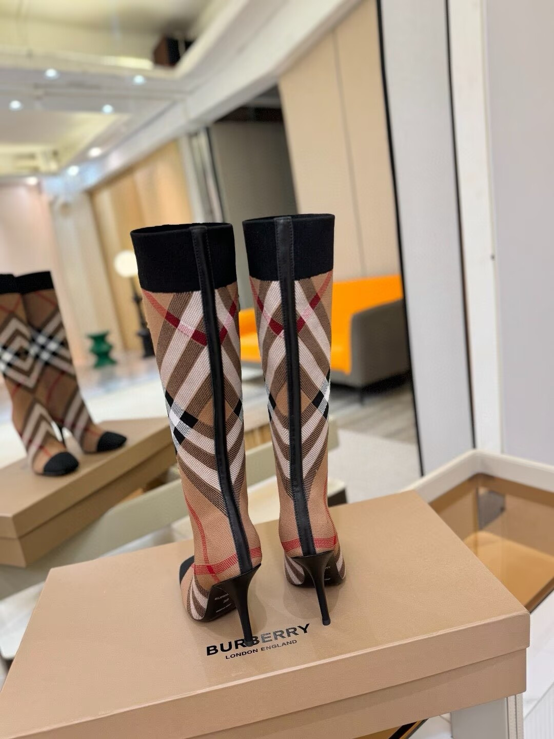 ua Bv*b*rry check high boots