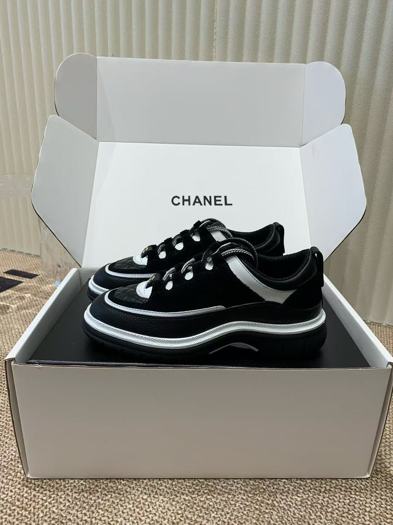 UA Ch**el Sneaker