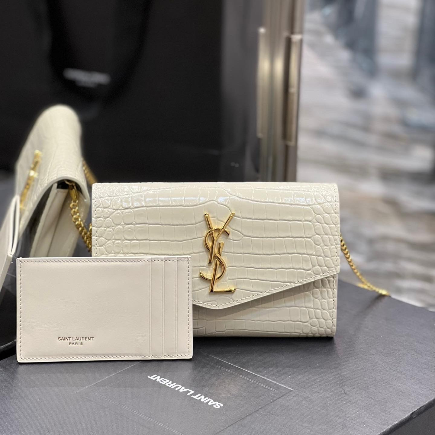 UPTOWN CHAIN WALLET IN CROCODILE-EMBOSSED SHINY LEATHER