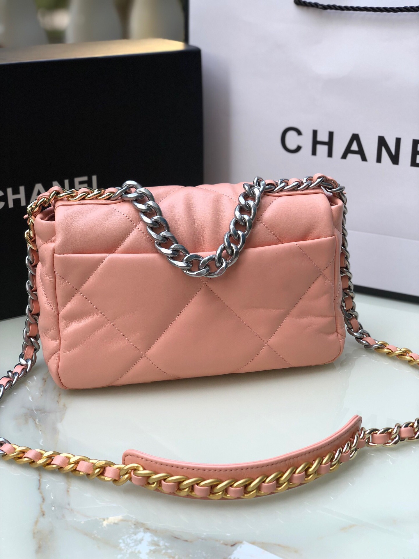 Ch**el 19 HANDBAG Shiny Leather, Gold-Tone, Silver-Tone & Ruthenium-Finish Metal Light Pink 6.2 × 10.1 × 3.5 in