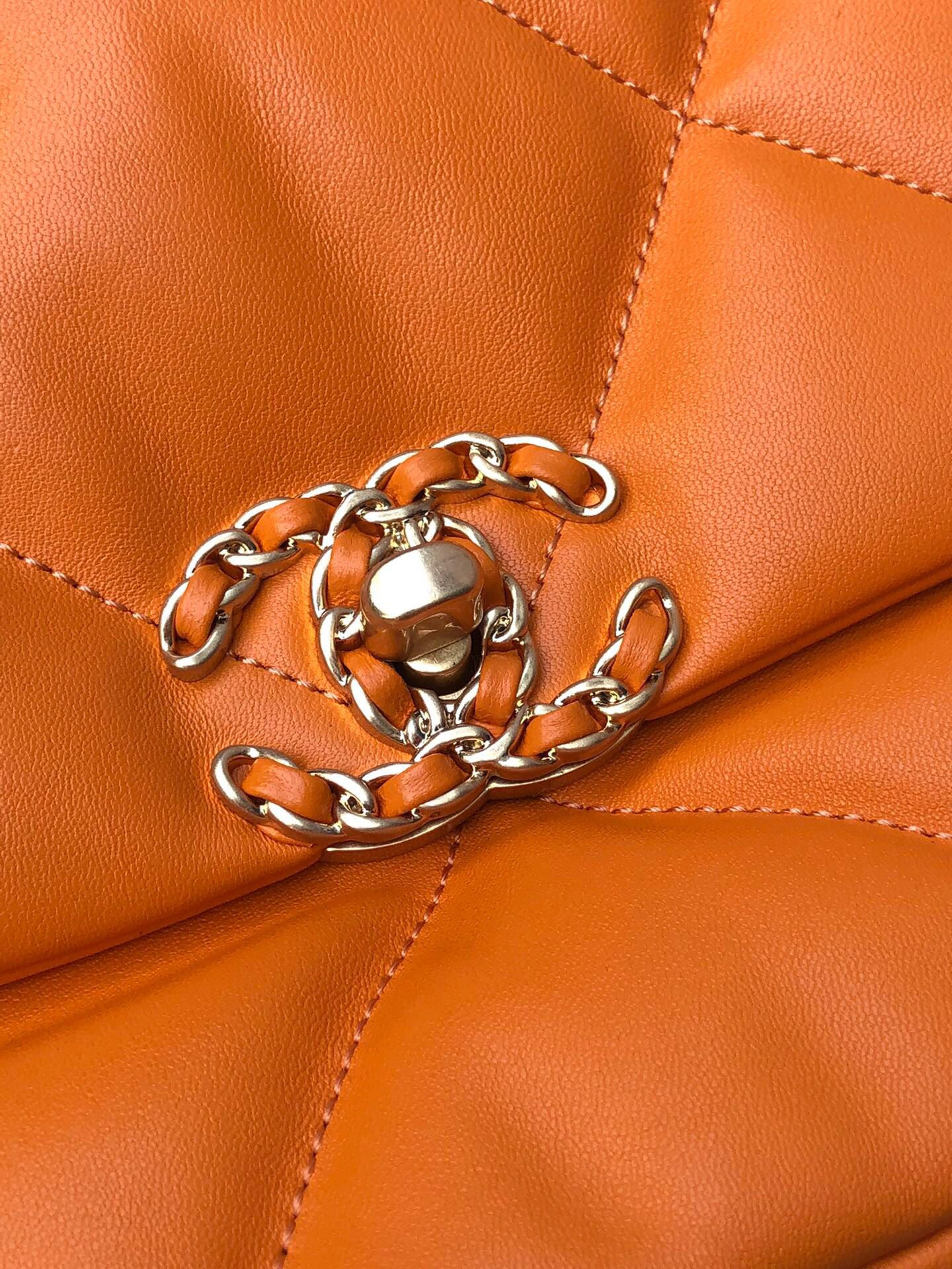 Ch**el 19 LARGE HANDBAG Shiny Leather, Gold-Tone, Silver-Tone & Ruthenium-Finish Metal Orange 7.8 × 11.7 × 3.9 in
