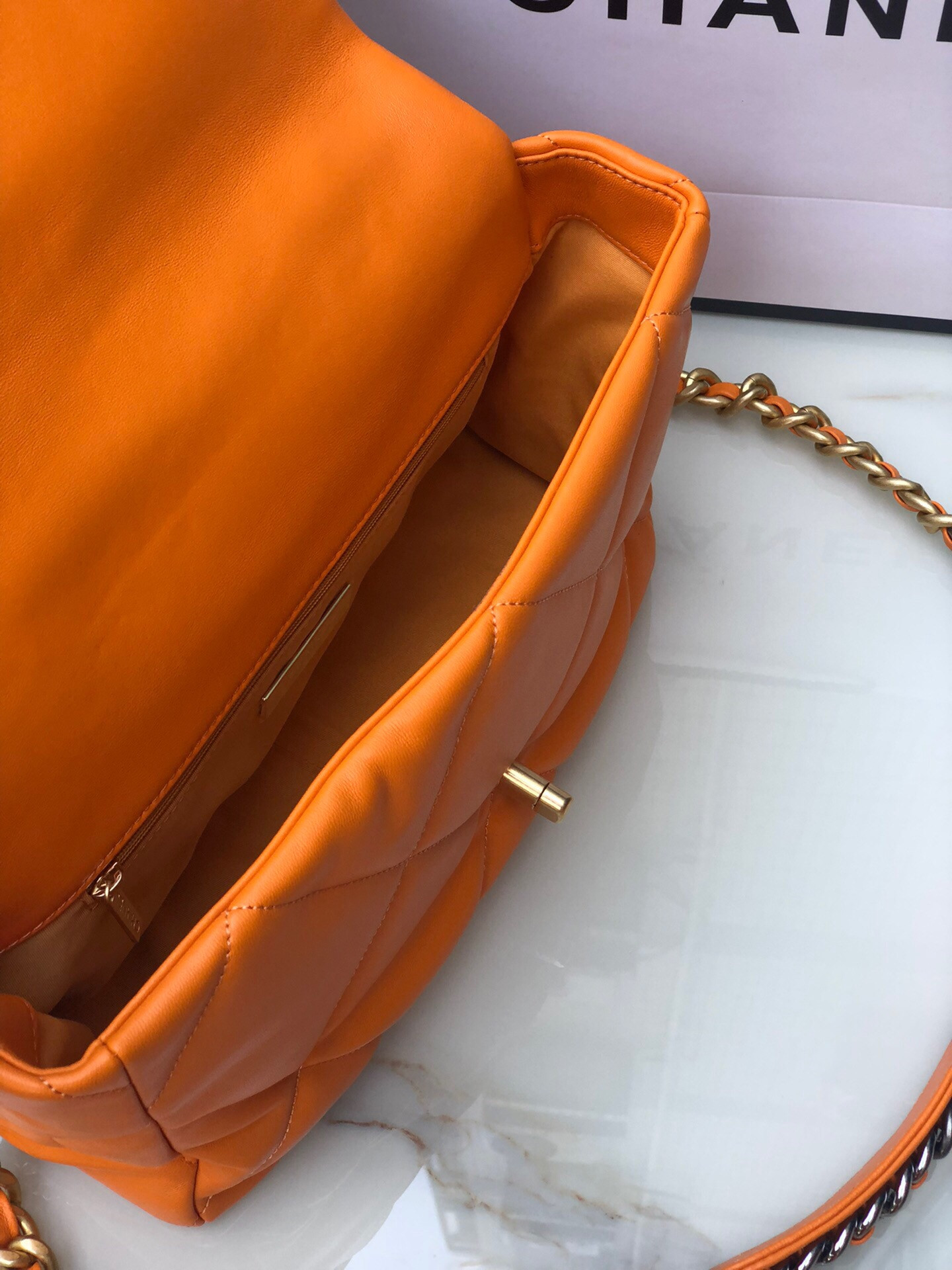 Ch**el 19 LARGE HANDBAG Shiny Leather, Gold-Tone, Silver-Tone & Ruthenium-Finish Metal Orange 7.8 × 11.7 × 3.9 in